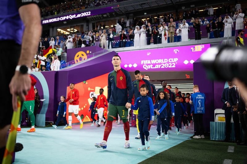 DOHA, QATAR - NOVEMBER 24: Cristiano Ronaldo of Portugal is seen in the tunnel with player mascots prior to the FIFA World Cup Qatar 2022 Group H match between Portugal and Ghana at Stadium 974 on November 24, 2022 in Doha, Qatar. (Photo by Sarah Stier - FIFA/FIFA via Getty Images)