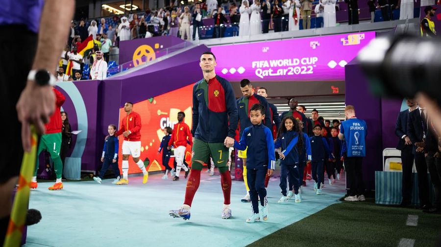 DOHA, QATAR - NOVEMBER 24: Cristiano Ronaldo of Portugal is seen in the tunnel with player mascots prior to the FIFA World Cup Qatar 2022 Group H match between Portugal and Ghana at Stadium 974 on November 24, 2022 in Doha, Qatar. (Photo by Sarah Stier - FIFA/FIFA via Getty Images)