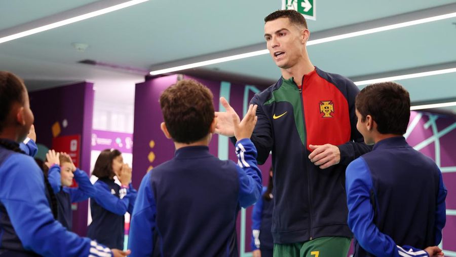 DOHA, QATAR - NOVEMBER 24: Cristiano Ronaldo of Portugal is seen in the tunnel with player mascots prior to the FIFA World Cup Qatar 2022 Group H match between Portugal and Ghana at Stadium 974 on November 24, 2022 in Doha, Qatar. (Photo by Sarah Stier - FIFA/FIFA via Getty Images)