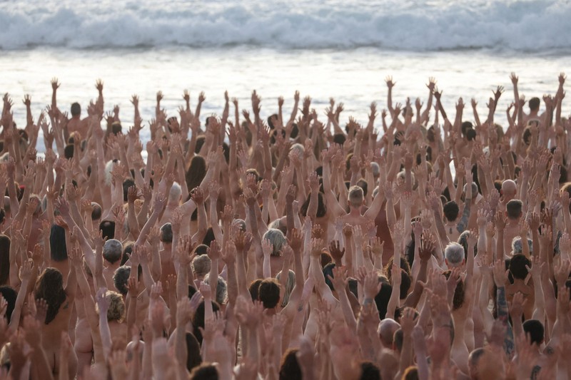 People stand naked as part of artist Spencer Tunick's art installation to raise awareness of skin cancer and encourage people to have their skin checked, at Bondi Beach in Sydney, Australia, November 26, 2022.  REUTERS/Loren Elliott  EDITORIAL USE ONLY.