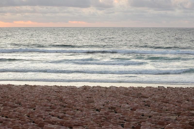 People stand naked as part of artist Spencer Tunick's art installation to raise awareness of skin cancer and encourage people to have their skin checked, at Bondi Beach in Sydney, Australia, November 26, 2022.  REUTERS/Loren Elliott  EDITORIAL USE ONLY.
