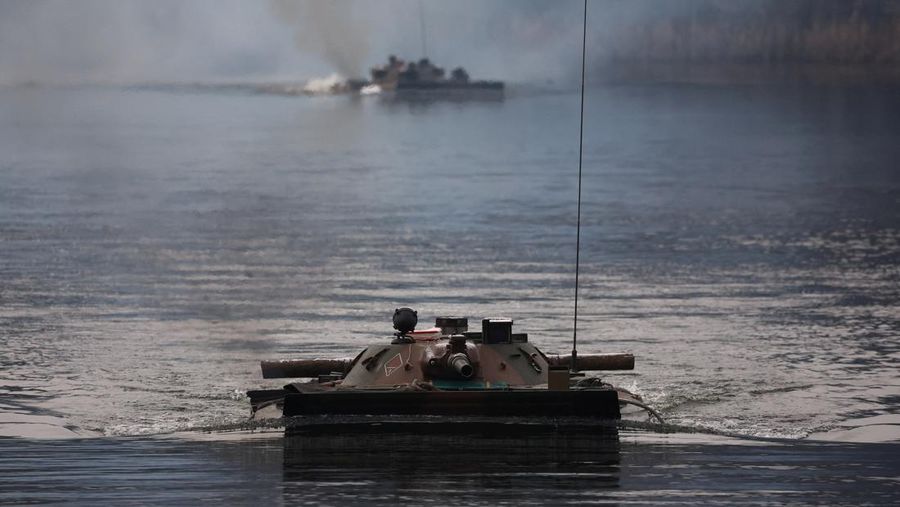 Polish Infantry fighting vehicle BWP crosses the lake during TUMAK-22 NATO exercises in an area known as the Suwalki Gap, of crucial significance to the security of the alliance's eastern flank, at a polygon in Klusy, Poland November 25, 2022. REUTERS/Kacper Pempel