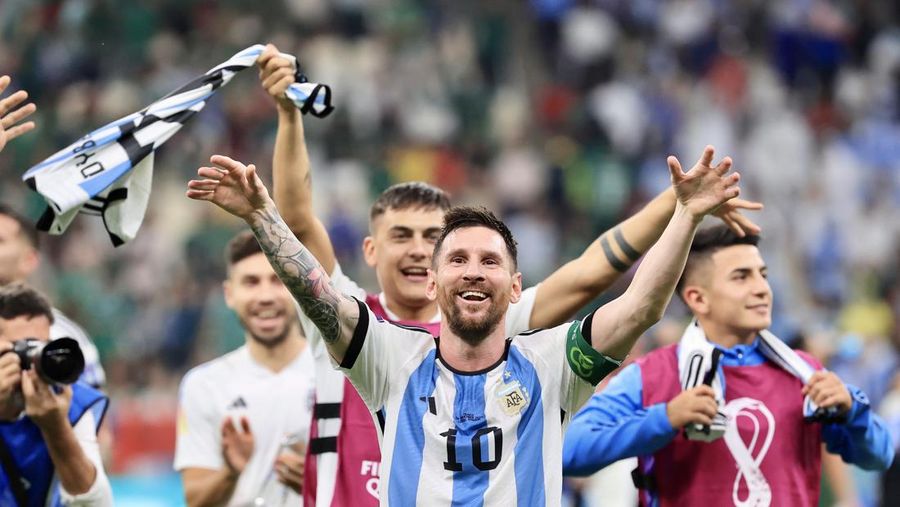 LUSAIL CITY, QATAR - NOVEMBER 26: Lionel Messi (10) of Argentina celebrates with his teammates after winning the FIFA World Cup Qatar 2022 Group C match between Argentina and Mexico at Lusail Stadium on November 26, 2022 in Lusail City, Qatar. (Photo by Mohammed Dabbous/Anadolu Agency via Getty Images)
