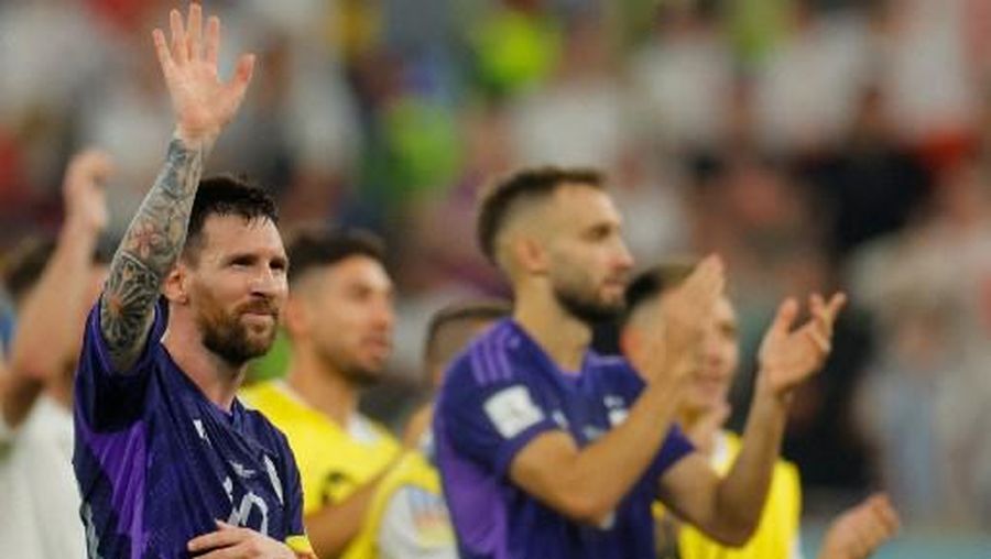 Argentina's forward #10 Lionel Messi (L) waves to supporters after his team won the Qatar 2022 World Cup Group C football match between Poland and Argentina at Stadium 974 in Doha on November 30, 2022. (Photo by Odd ANDERSEN / AFP)