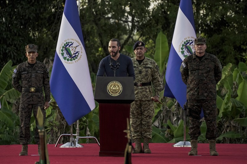 23 November 2022, El Salvador, San Juan Opico: Soldiers stand in formation while listening to President Bukele announce the fifth phase of the government's security policy against gangs. The Salvadoran government announced the fifth phase of its territorial control plan, which consists of militarily securing parts of cities. El Salvador has been under a state of emergency for eight months, as a result of which more than 57,000 suspected criminals have been arrested. Photo: Camilo Freedman/dpa (Photo by Camilo Freedman/picture alliance via Getty Images)