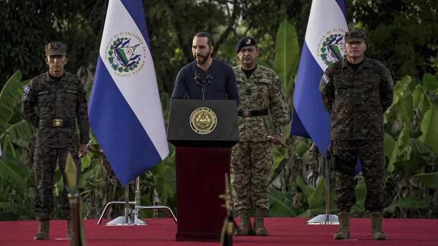 23 November 2022, El Salvador, San Juan Opico: Soldiers stand in formation while listening to President Bukele announce the fifth phase of the government's security policy against gangs. The Salvadoran government announced the fifth phase of its territorial control plan, which consists of militarily securing parts of cities. El Salvador has been under a state of emergency for eight months, as a result of which more than 57,000 suspected criminals have been arrested. Photo: Camilo Freedman/dpa (Photo by Camilo Freedman/picture alliance via Getty Images)