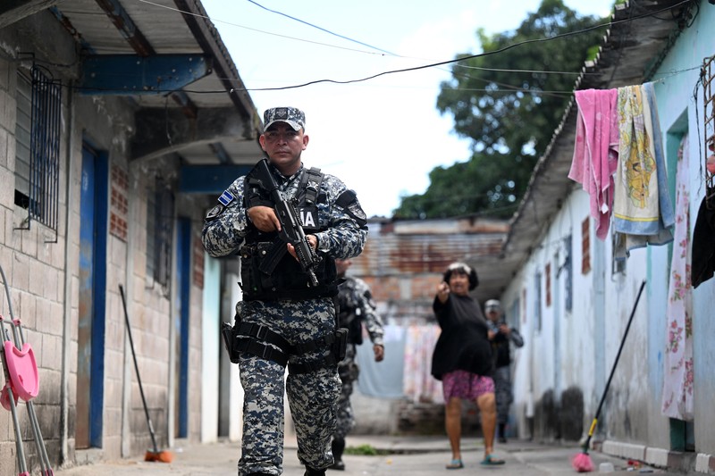 23 November 2022, El Salvador, San Juan Opico: Soldiers stand in formation while listening to President Bukele announce the fifth phase of the government's security policy against gangs. The Salvadoran government announced the fifth phase of its territorial control plan, which consists of militarily securing parts of cities. El Salvador has been under a state of emergency for eight months, as a result of which more than 57,000 suspected criminals have been arrested. Photo: Camilo Freedman/dpa (Photo by Camilo Freedman/picture alliance via Getty Images)