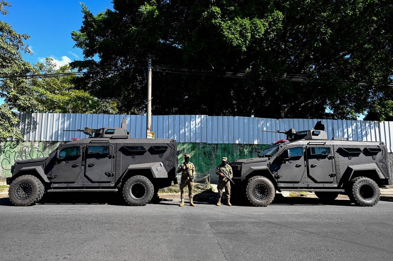 23 November 2022, El Salvador, San Juan Opico: Soldiers stand in formation while listening to President Bukele announce the fifth phase of the government's security policy against gangs. The Salvadoran government announced the fifth phase of its territorial control plan, which consists of militarily securing parts of cities. El Salvador has been under a state of emergency for eight months, as a result of which more than 57,000 suspected criminals have been arrested. Photo: Camilo Freedman/dpa (Photo by Camilo Freedman/picture alliance via Getty Images)