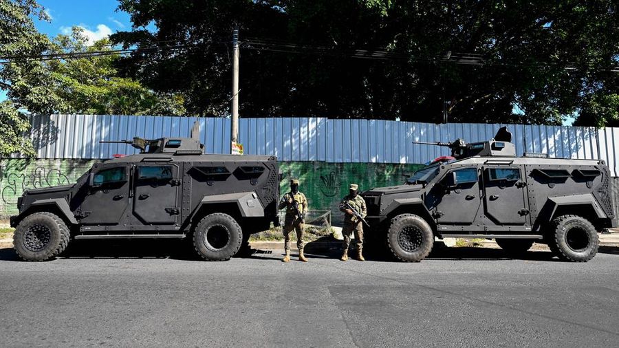 23 November 2022, El Salvador, San Juan Opico: Soldiers stand in formation while listening to President Bukele announce the fifth phase of the government's security policy against gangs. The Salvadoran government announced the fifth phase of its territorial control plan, which consists of militarily securing parts of cities. El Salvador has been under a state of emergency for eight months, as a result of which more than 57,000 suspected criminals have been arrested. Photo: Camilo Freedman/dpa (Photo by Camilo Freedman/picture alliance via Getty Images)