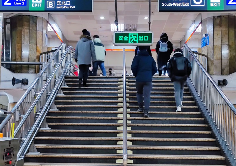 BEIJING, CHIAN - DECEMBER 5, 2022 - A light passenger flow is seen during the morning rush hour on Metro Line 5 in Beijing, China, December 5, 2022. On the same day, Beijing cancelled nucleic acid inspection on buses and subways. (Photo credit should read CFOTO/Future Publishing via Getty Images)