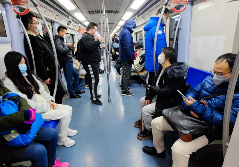 BEIJING, CHIAN - DECEMBER 5, 2022 - A light passenger flow is seen during the morning rush hour on Metro Line 5 in Beijing, China, December 5, 2022. On the same day, Beijing cancelled nucleic acid inspection on buses and subways. (Photo credit should read CFOTO/Future Publishing via Getty Images)