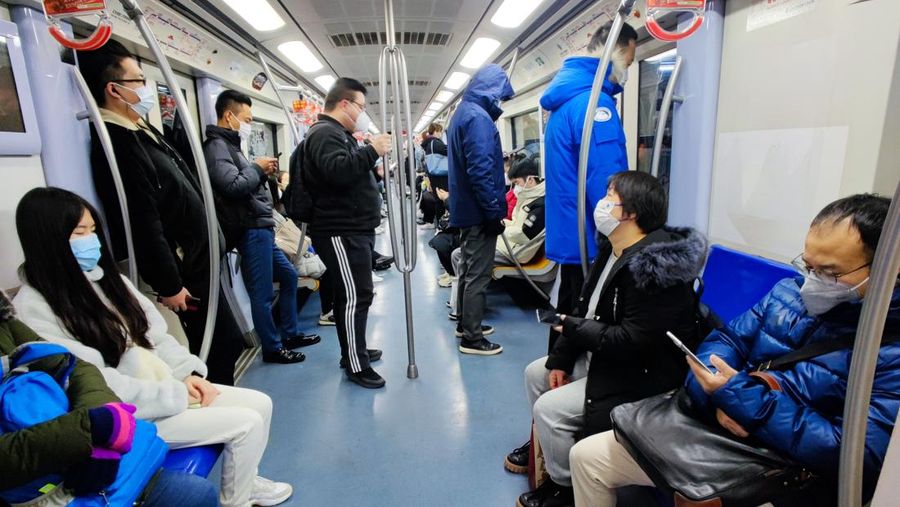 BEIJING, CHIAN - DECEMBER 5, 2022 - A light passenger flow is seen during the morning rush hour on Metro Line 5 in Beijing, China, December 5, 2022. On the same day, Beijing cancelled nucleic acid inspection on buses and subways. (Photo credit should read CFOTO/Future Publishing via Getty Images)