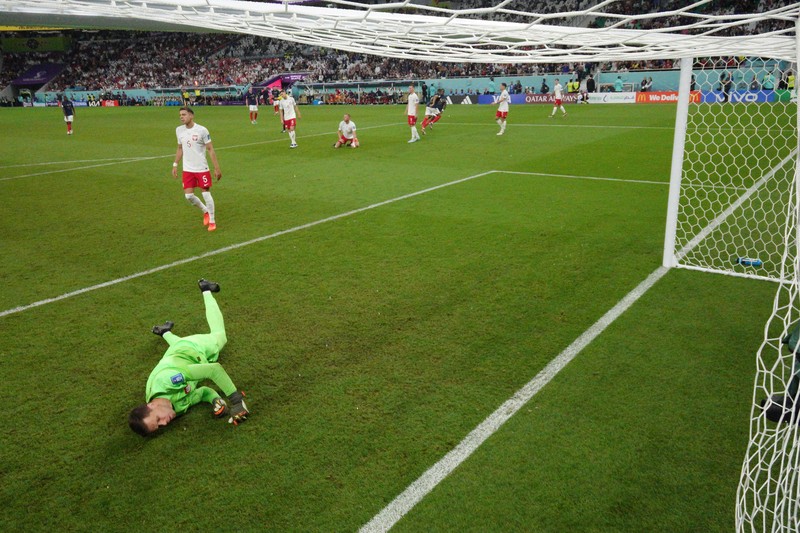 SOCCER-WORLDCUP-FRA-POL/REPORT Soccer Football - FIFA World Cup Qatar 2022 - Round of 16 - France v Poland - Al Thumama Stadium, Doha, Qatar - December 4, 2022 France's Kylian Mbappe in action with Poland's Matty Cash REUTERS/Dylan Martinez TPX IMAGES OF THE DAY