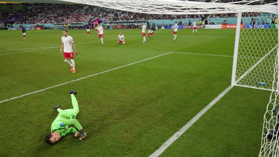 Soccer Football - FIFA World Cup Qatar 2022 - Round of 16 - France v Poland - Al Thumama Stadium, Doha, Qatar - December 4, 2022 France's Kylian Mbappe in action with Poland's Matty Cash REUTERS/Dylan Martinez     TPX IMAGES OF THE DAY