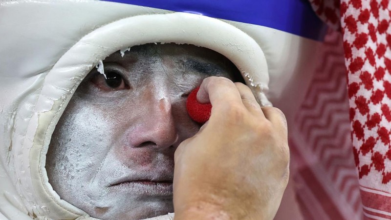 AL WAKRAH, QATAR - DECEMBER 05: A Japanese fan uses his sponge nose to dab tears from his eyes during the FIFA World Cup Qatar 2022 Round of 16 match between Japan and Croatia at Al Janoub Stadium on December 5, 2022 in Al Wakrah, Qatar. (Photo by Charlotte Wilson/Offside/Offside via Getty Images)