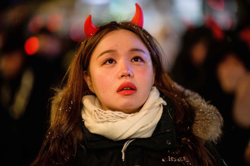 AL WAKRAH, QATAR - DECEMBER 05: A Japanese fan uses his sponge nose to dab tears from his eyes during the FIFA World Cup Qatar 2022 Round of 16 match between Japan and Croatia at Al Janoub Stadium on December 5, 2022 in Al Wakrah, Qatar. (Photo by Charlotte Wilson/Offside/Offside via Getty Images)