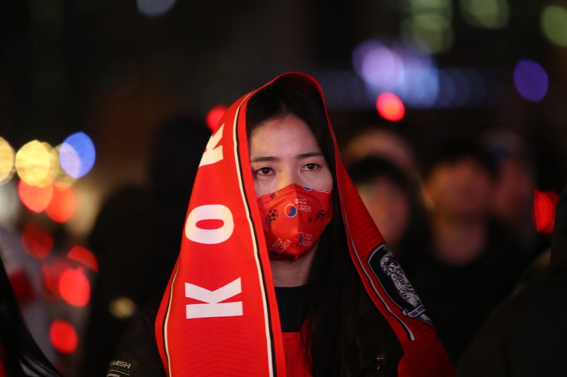 1245392905 AL WAKRAH, QATAR - DECEMBER 05: A Japanese fan uses his sponge nose to dab tears from his eyes during the FIFA World Cup Qatar 2022 Round of 16 match between Japan and Croatia at Al Janoub Stadium on December 5, 2022 in Al Wakrah, Qatar. (Photo by Charlotte Wilson/Offside/Offside via Getty Images)