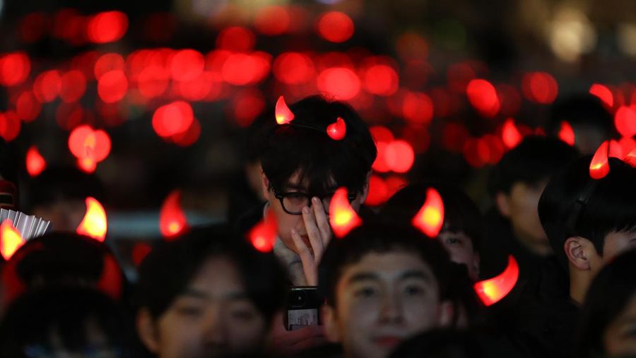 AL WAKRAH, QATAR - DECEMBER 05: A Japanese fan uses his sponge nose to dab tears from his eyes during the FIFA World Cup Qatar 2022 Round of 16 match between Japan and Croatia at Al Janoub Stadium on December 5, 2022 in Al Wakrah, Qatar. (Photo by Charlotte Wilson/Offside/Offside via Getty Images)