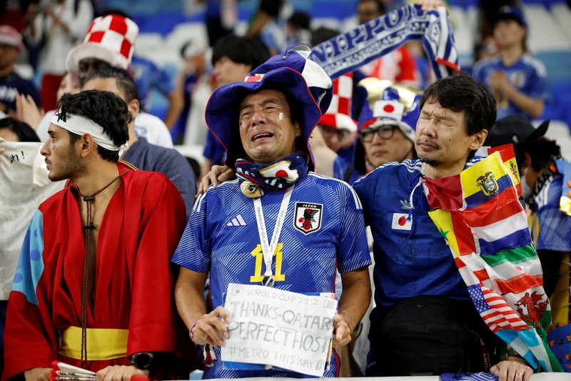 AL WAKRAH, QATAR - DECEMBER 05: A Japanese fan uses his sponge nose to dab tears from his eyes during the FIFA World Cup Qatar 2022 Round of 16 match between Japan and Croatia at Al Janoub Stadium on December 5, 2022 in Al Wakrah, Qatar. (Photo by Charlotte Wilson/Offside/Offside via Getty Images)