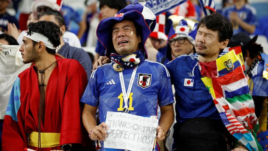 AL WAKRAH, QATAR - DECEMBER 05: A Japanese fan uses his sponge nose to dab tears from his eyes during the FIFA World Cup Qatar 2022 Round of 16 match between Japan and Croatia at Al Janoub Stadium on December 5, 2022 in Al Wakrah, Qatar. (Photo by Charlotte Wilson/Offside/Offside via Getty Images)