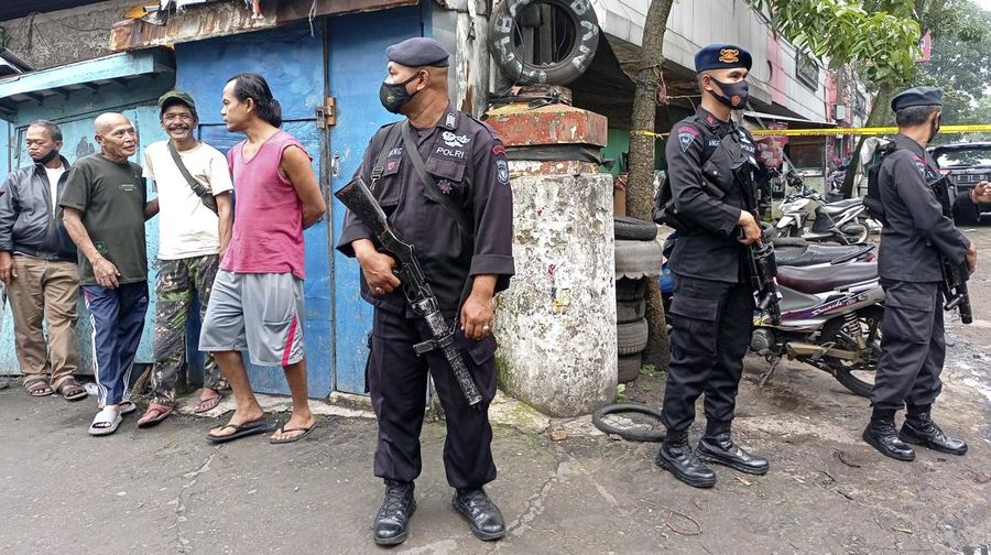 Officers guard a road block on a street leading to a police station where an explosion went off in Bandung, West Java, Indonesia, Wednesday, Dec. 7, 2022. A man blew himself up Wednesday outside a police station on Indonesia’s main island of Java in what appeared to be the latest in a string of suicide attacks in the world’s most populous Muslim nation. (AP Photo/Ahmad Fauzan)