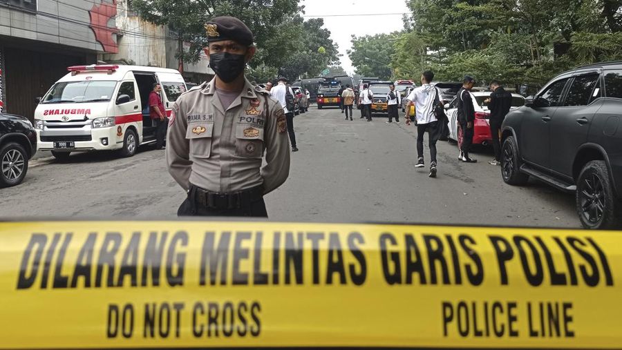 Officers guard a road block on a street leading to a police station where an explosion went off in Bandung, West Java, Indonesia, Wednesday, Dec. 7, 2022. A man blew himself up Wednesday outside a police station on Indonesia’s main island of Java in what appeared to be the latest in a string of suicide attacks in the world’s most populous Muslim nation. (AP Photo/Ahmad Fauzan)