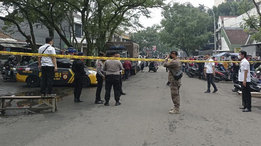 Officers guard a road block on a street leading to a police station where an explosion went off in Bandung, West Java, Indonesia, Wednesday, Dec. 7, 2022. A man blew himself up Wednesday outside a police station on Indonesia’s main island of Java in what appeared to be the latest in a string of suicide attacks in the world’s most populous Muslim nation. (AP Photo/Ahmad Fauzan)