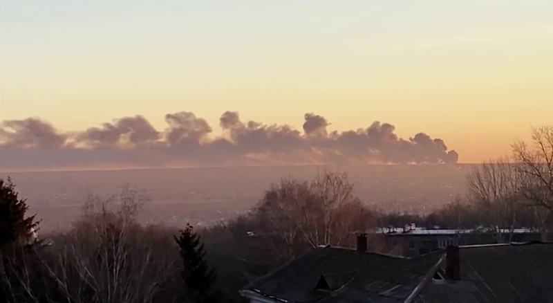 In this handout photo released by the administration of the Kursk region of Russia on Tuesday, Dec. 6, 2022, smoke rises from the area of Kursk airport outside Kursk, Russia. A fire that broke out at an airport in Russia’s southern Kursk region that borders Ukraine was the result of a drone attack, the Kursk regional governor said Tuesday, a day after Moscow blamed Kyiv for drone strikes on two air bases deep inside Russia and launched a new wave of missile strikes on Ukrainian territory.  (Administration of the Kursk region of Russia via AP)