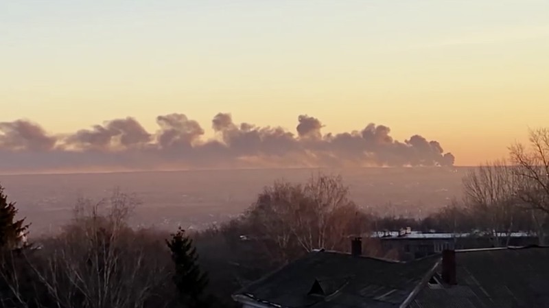 In this handout photo released by the administration of the Kursk region of Russia on Tuesday, Dec. 6, 2022, smoke rises from the area of Kursk airport outside Kursk, Russia. A fire that broke out at an airport in Russia’s southern Kursk region that borders Ukraine was the result of a drone attack, the Kursk regional governor said Tuesday, a day after Moscow blamed Kyiv for drone strikes on two air bases deep inside Russia and launched a new wave of missile strikes on Ukrainian territory.  (Administration of the Kursk region of Russia via AP)