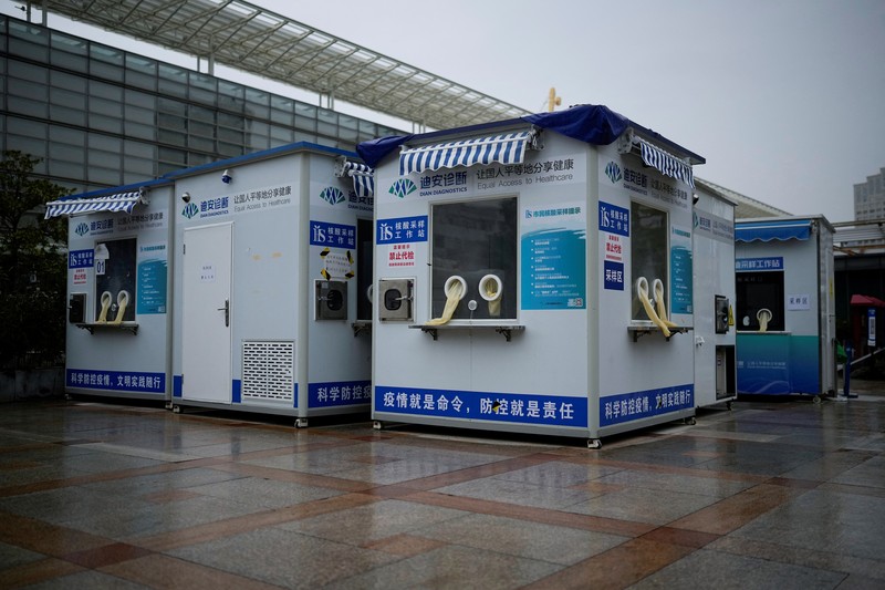 HEALTH-CORONAVIRUS/CHINA Closed mobile nucleic acid testing booths are pictured outside the Shanghai Railway Station as coronavirus disease (COVID-19) outbreaks continue in Shanghai, China, December 8, 2022. REUTERS/Aly Song