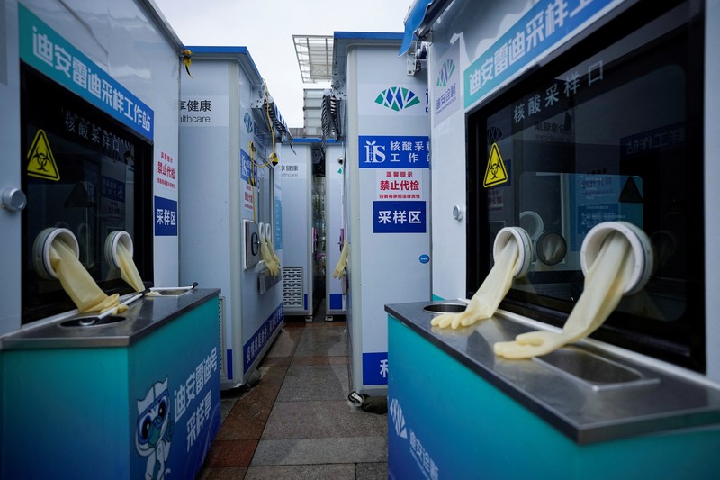 HEALTH-CORONAVIRUS/CHINA Closed mobile nucleic acid testing booths are pictured outside the Shanghai Railway Station as coronavirus disease (COVID-19) outbreaks continue in Shanghai, China, December 8, 2022. REUTERS/Aly Song