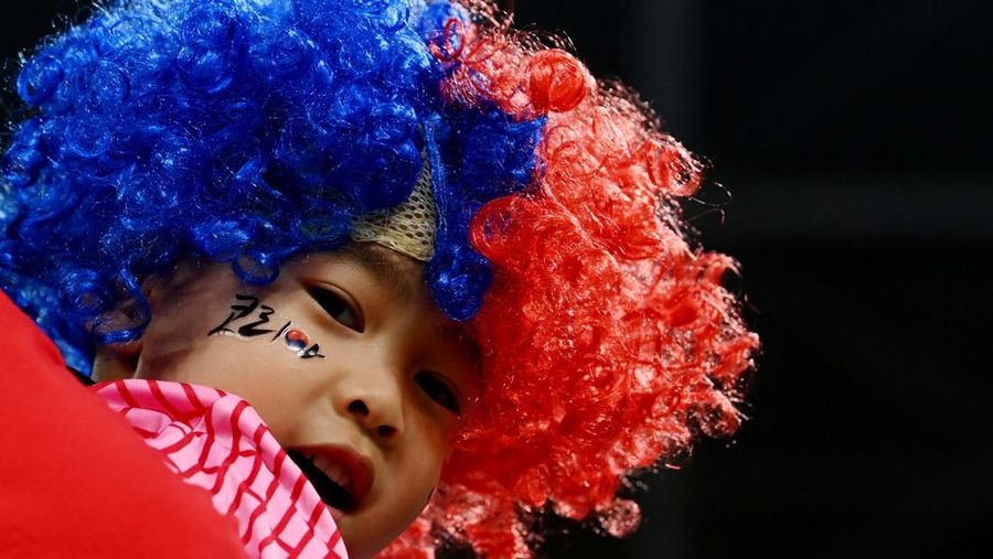 Soccer Football - FIFA World Cup Qatar 2022 - Group D - Tunisia v France - Education City Stadium, Al Rayyan, Qatar - November 30, 2022 A young fan inside the stadium before the match REUTERS/Carl Recine     TPX IMAGES OF THE DAY