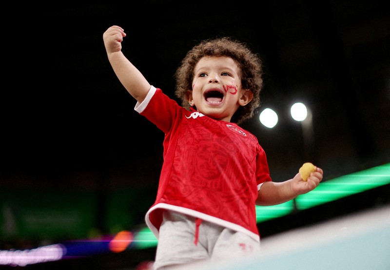 Soccer Football - FIFA World Cup Qatar 2022 - Group D - Tunisia v France - Education City Stadium, Al Rayyan, Qatar - November 30, 2022 A young fan inside the stadium before the match REUTERS/Carl Recine     TPX IMAGES OF THE DAY