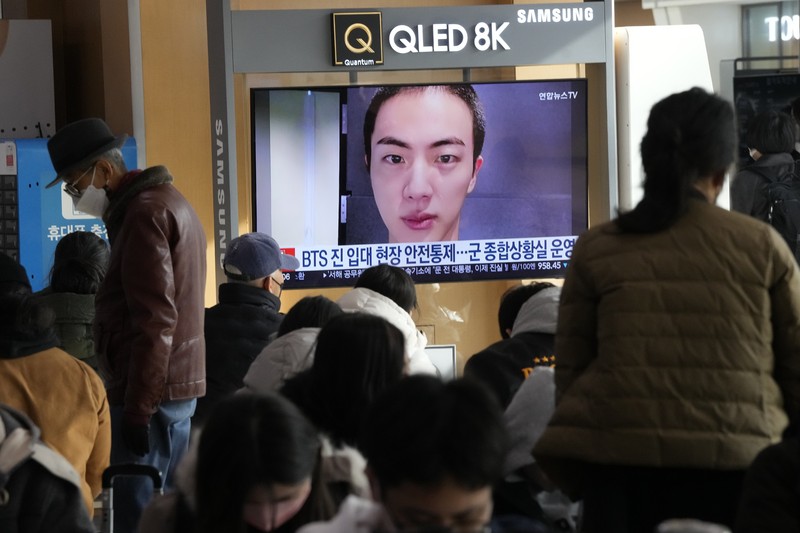 South Koreaa BTS Military Service Fans wait for K-pop band BTS's member Jin to arrive before he enters the army to serve near an army training center in Yeoncheon, South Korea, Tuesday, Dec. 13, 2022. Jin, the oldest member of K-pop supergroup BTS, was set to enter a frontline South Korean boot camp Tuesday to start his 18 months of mandatory military service, as fans gathered near the base to say goodbye to their star. (AP Photo/Ahn Young-joon)