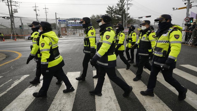 Fans wait for K-pop band BTS's member Jin to arrive before he enters the army to serve near an army training center in Yeoncheon, South Korea, Tuesday, Dec. 13, 2022. Jin, the oldest member of K-pop supergroup BTS, was set to enter a frontline South Korean boot camp Tuesday to start his 18 months of mandatory military service, as fans gathered near the base to say goodbye to their star. (AP Photo/Ahn Young-joon)