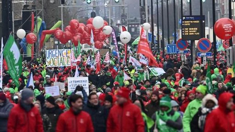People take part in a nation-wide demonstration organized by the three national trade unions to demand more measures against the rising cost of living, on December 16, 2022 in Brussels. (Photo by DIRK WAEM / various sources / AFP) / Belgium OUT