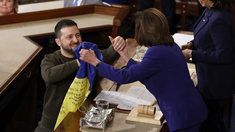 WASHINGTON, DC - DECEMBER 21: President of Ukraine Volodymyr Zelensky greets Rep. Rosa Delauro (D-CT) and other lawmakers as he arrives to address a joint meeting of Congress in the House Chamber of the U.S. Capitol on December 21, 2022 in Washington, DC. In his first known trip outside of Ukraine since Russia invaded, Zelensky met with U.S. President Joe Biden and outlined Ukraine's request for continued military aid. Seated behind Zelensky was U.S. Vice President Kamala Harris (L) and Speaker of the House Nancy Pelosi (D-CA).  (Photo by Anna Moneymaker/Getty Images)