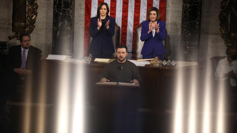 President of Ukraine Volodymyr Zelensky addresses a joint meeting of Congress in the House Chamber of the U.S. Capitol on December 21, 2022 in Washington, DC. In his first known trip outside of Ukraine since Russia invaded, Zelensky met with U.S. President Joe Biden and outlined Ukraine's request for continued military aid. Seated behind Zelensky was U.S. Vice President Kamala Harris (L) and Speaker of the House Nancy Pelosi (D-CA). (Photo by Chip Somodevilla/Getty Images)