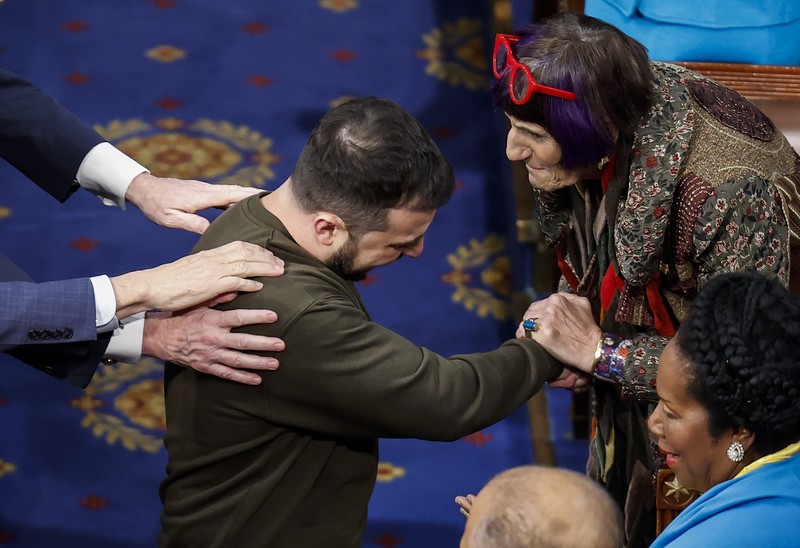 WASHINGTON, DC - DECEMBER 21: President of Ukraine Volodymyr Zelensky greets Rep. Rosa Delauro (D-CT) and other lawmakers as he arrives to address a joint meeting of Congress in the House Chamber of the U.S. Capitol on December 21, 2022 in Washington, DC. In his first known trip outside of Ukraine since Russia invaded, Zelensky met with U.S. President Joe Biden and outlined Ukraine's request for continued military aid. Seated behind Zelensky was U.S. Vice President Kamala Harris (L) and Speaker of the House Nancy Pelosi (D-CA).  (Photo by Anna Moneymaker/Getty Images)
