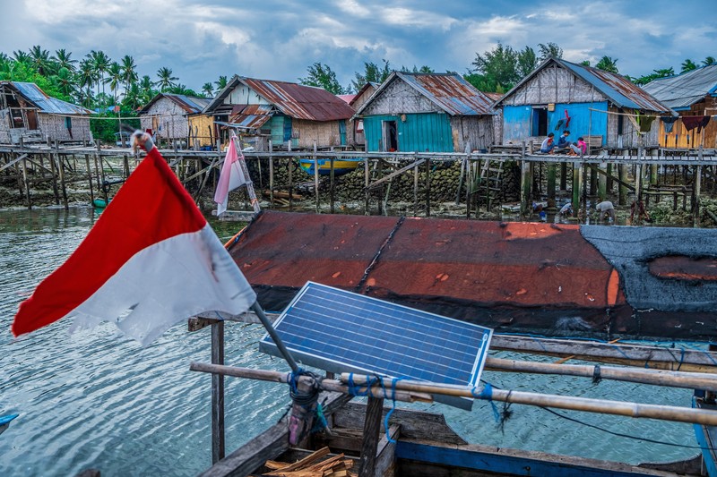 BUTON, SOUTH EAST SULAWESI, INDONESIA - 2020/10/01: Dimas Saputra (10 years old) is seen posing with his favorite boat right in front of his house.
The life of the Bajo tribe, from birth to adulthood, is dependent on the sea. Everything is done there, from looking for food to all life activities carried out in the sea. Dimas Saputra is one of the many children who became an accomplished bajo child with extraordinary diving skills at a young age. Since childhood, his father Muhammad Ajran (36 years old) and his mother Sunarti (35 years old) have been accustomed to knowing and uniting with nature. (Photo by Andry Denisah/SOPA Images/LightRocket via Getty Images)