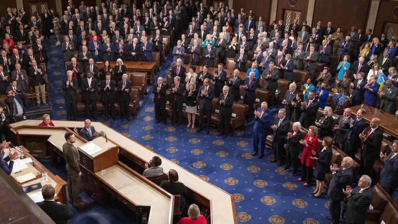 President of Ukraine Volodymyr Zelensky addresses a joint meeting of Congress in the House Chamber of the U.S. Capitol on December 21, 2022 in Washington, DC. In his first known trip outside of Ukraine since Russia invaded, Zelensky met with U.S. President Joe Biden and outlined Ukraine's request for continued military aid. Seated behind Zelensky was U.S. Vice President Kamala Harris (L) and Speaker of the House Nancy Pelosi (D-CA).  (Photo by Chip Somodevilla/Getty Images)