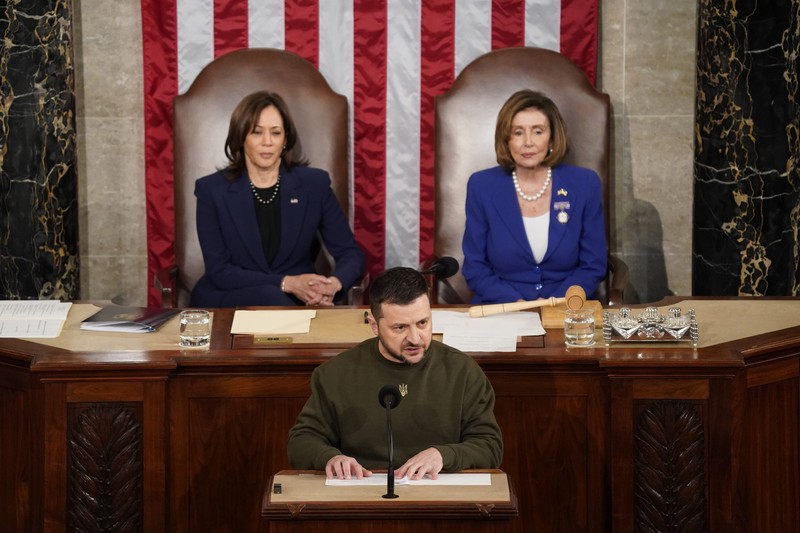 President of Ukraine Volodymyr Zelensky addresses a joint meeting of Congress in the House Chamber of the U.S. Capitol on December 21, 2022 in Washington, DC. In his first known trip outside of Ukraine since Russia invaded, Zelensky met with U.S. President Joe Biden and outlined Ukraine's request for continued military aid. Seated behind Zelensky was U.S. Vice President Kamala Harris (L) and Speaker of the House Nancy Pelosi (D-CA).  (Photo by Chip Somodevilla/Getty Images)