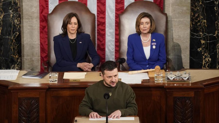 President of Ukraine Volodymyr Zelensky addresses a joint meeting of Congress in the House Chamber of the U.S. Capitol on December 21, 2022 in Washington, DC. In his first known trip outside of Ukraine since Russia invaded, Zelensky met with U.S. President Joe Biden and outlined Ukraine's request for continued military aid. Seated behind Zelensky was U.S. Vice President Kamala Harris (L) and Speaker of the House Nancy Pelosi (D-CA).  (Photo by Chip Somodevilla/Getty Images)