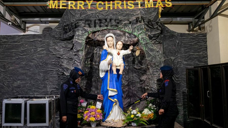 Anti-terror police check security at a church ahead of Christmas eve in Medan on December 24, 2022. (Photo by ARIANDI / AFP) (Photo by ARIANDI/AFP via Getty Images)