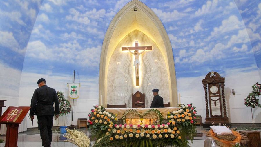 Anti-terror police check security at a church ahead of Christmas eve in Medan on December 24, 2022. (Photo by ARIANDI / AFP) (Photo by ARIANDI/AFP via Getty Images)