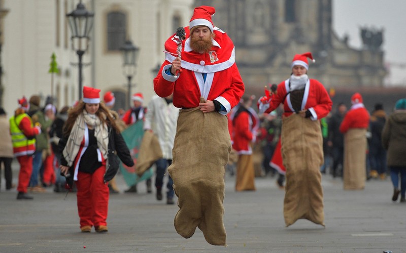 Issa Kassissieh dressed as Santa Claus flies above Jerusalem in a hot air balloon December 20, 2022. REUTERS/Amir Cohen