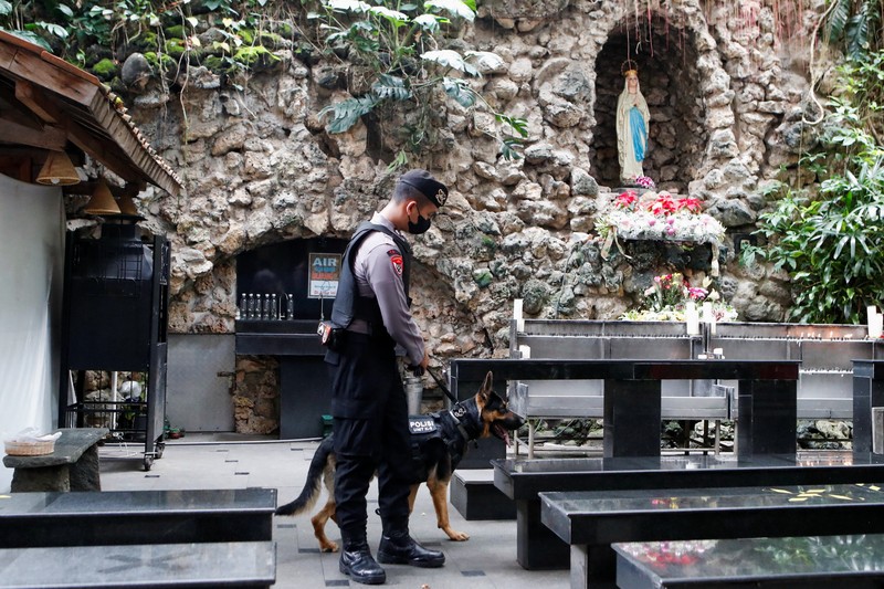 1245808930 Anti-terror police check security at a church ahead of Christmas eve in Medan on December 24, 2022. (Photo by ARIANDI / AFP) (Photo by ARIANDI/AFP via Getty Images)