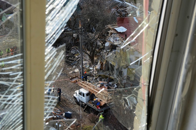 KYIV, UKRAINE - 2023/01/01: View of a destroyed residential building after a missile attack by Russia in Kyiv. Rocket attacks by Russia on December 31, 2022 in Kyiv, Ukraine. In many districts of Kyiv, a number of buildings were seriously damaged, 2 people died, and about 50 were injured. (Photo by Aleksandr Gusev/SOPA Images/LightRocket via Getty Images)