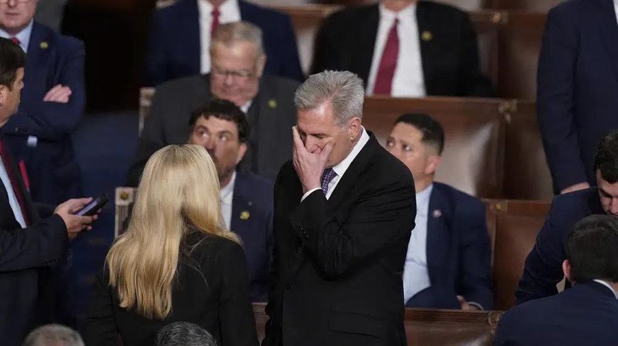 Rep. Kevin McCarthy, R-Calif., talks with Rep. Marjorie Taylor Greene, R-Ga., at the beginning of an evening session after six failed votes to elect a speaker and convene the 118th Congress in Washington, Wednesday, Jan. 4, 2023. (AP Photo/Alex Brandon)