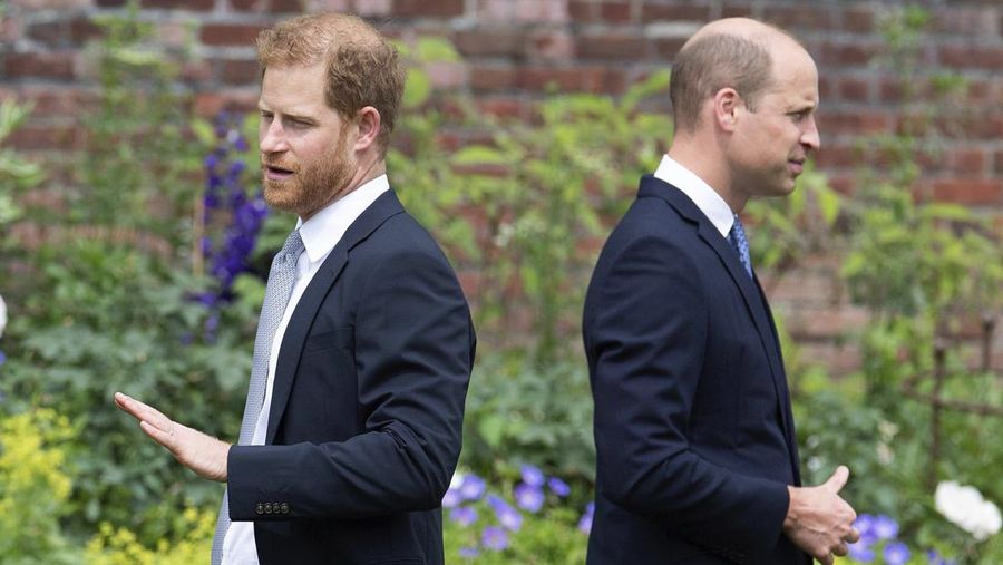 FILE - Prince Harry, left, and Prince William stand together during the unveiling of a statue they commissioned of their mother Princess Diana, on what would have been her 60th birthday, in the Sunken Garden at Kensington Palace, London, Thursday July 1, 2021. Prince Harry has said he wants to have his father and brother back and that he wants “a family, not an institution,” during a TV interview ahead of the publication of his memoir. The interview with Britain’s ITV channel is due to be released this Sunday. (Dominic Lipinski /Pool Photo via AP, File)